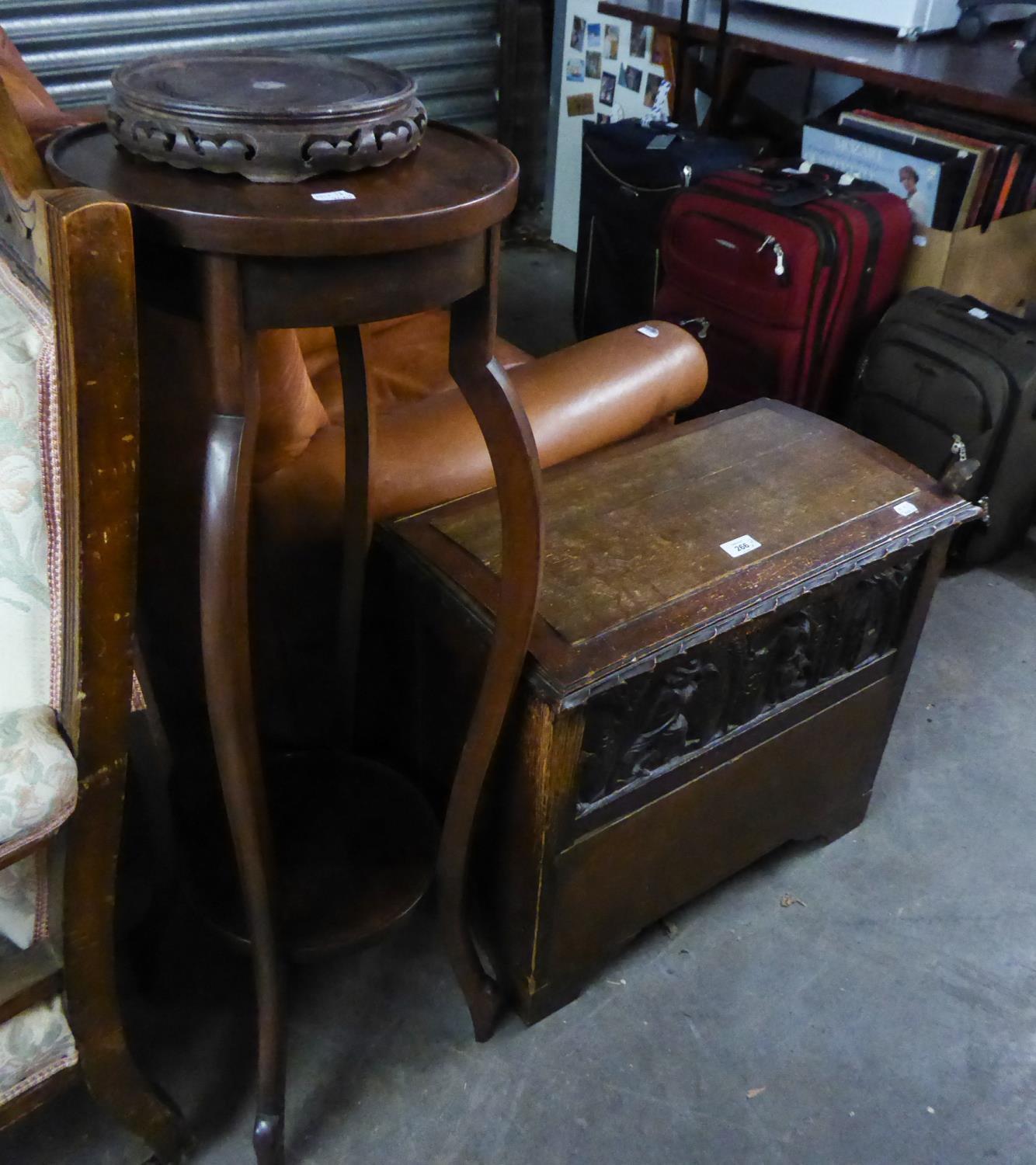 A SMALL OAK CHEST WITH SHALLOW DOMED TOP AND CARVED FRONTAL PANEL, ALSO AN EDWARDIAN PLANT STAND  (