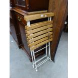 A PAIR OF WHITE WROUGHT IRON AND SLATTED WOOD FOLD FLAT CHAIRS (2)