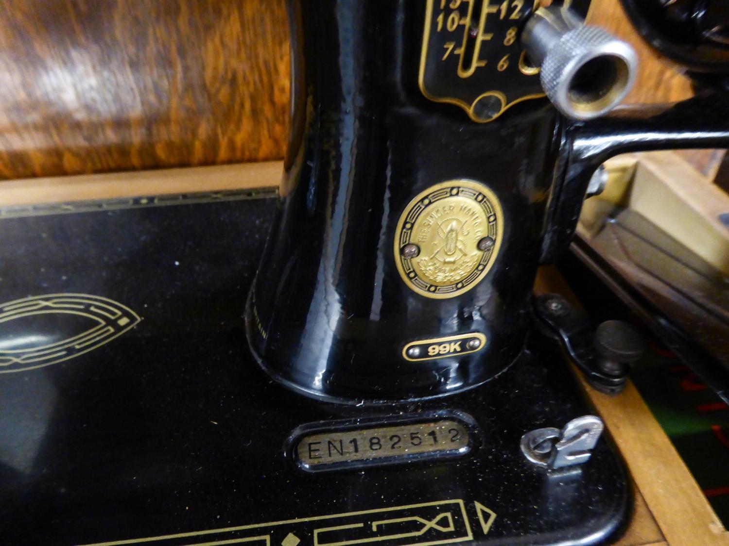 A CIRCULAR THREE DRAWER CHEST, A DECORATIVE WOODEN STICKSTAND AND A SINGER SEWING MACHINE (3) - Image 3 of 3