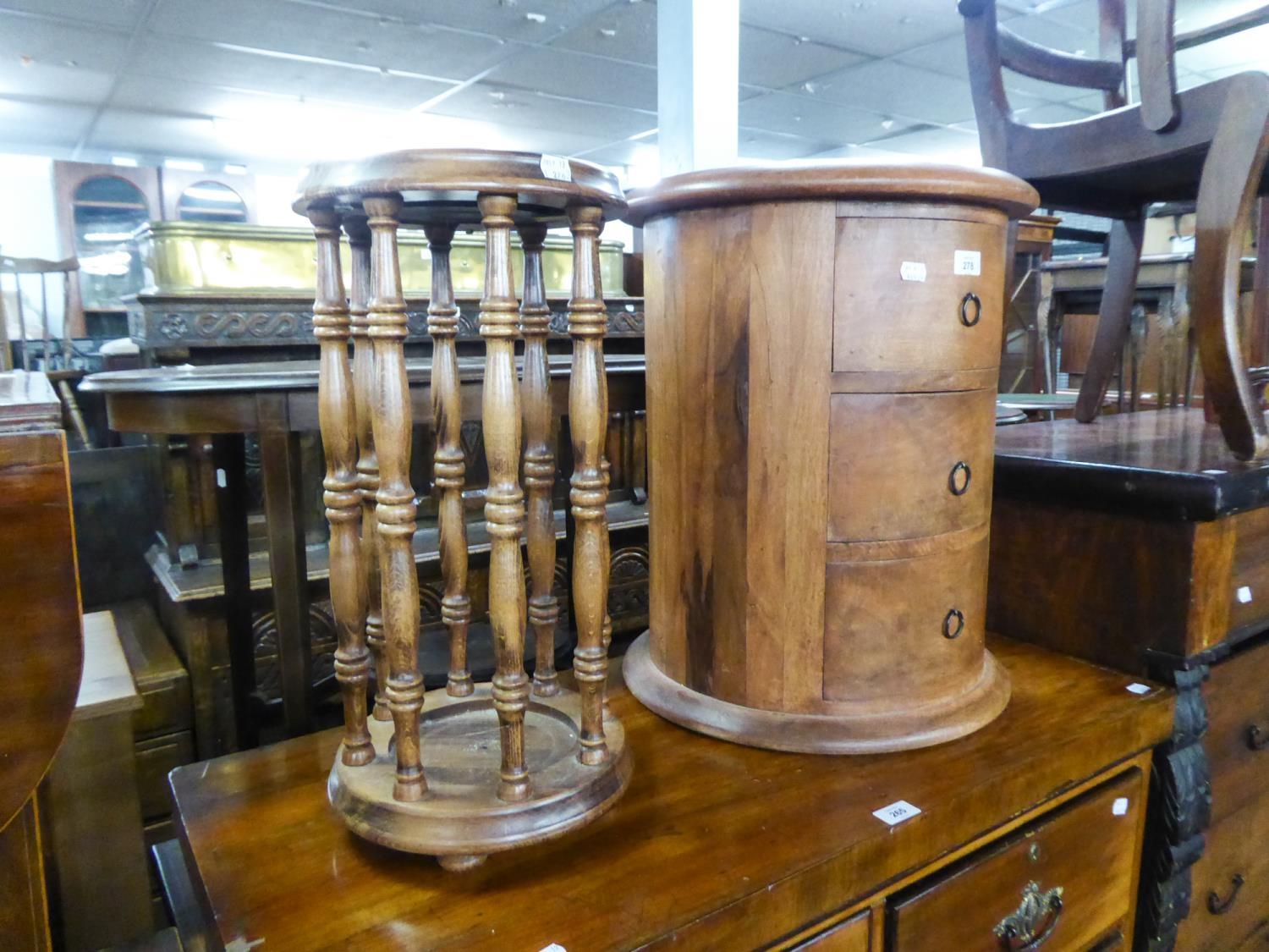 A CIRCULAR THREE DRAWER CHEST, A DECORATIVE WOODEN STICKSTAND AND A SINGER SEWING MACHINE (3)