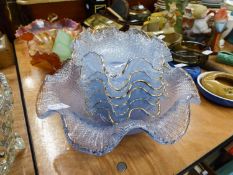 QUANTITY OF COLOURED GLASSWARES TO INCLUDE; THREE CARNIVAL GLASS RUFFLED BOWLS, A BLUE GLASS DESSERT