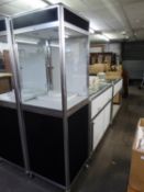 A MATCHING PAIR OF JEWELLERY COUNTER DISPLAY CABINETS, THE LOWER SECTION HAVING STORAGE AREA, THE