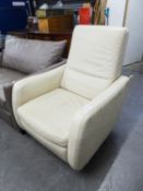 'ITAL' CREAM LEATHER UPHOLSTERED REVOLVING AND RECLINING ARMCHAIR, ON ALUMINIUM CIRCULAR BASE
