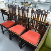 A SET OF FOUR JACOBEAN STYLE CARVED OAK SINGLE CHAIRS WITH SPLAT AND RAIL BACKS, DROP-IN SEATS , CUP