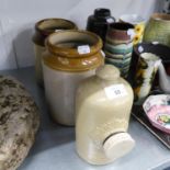 A STONEWARE HOT WATER BOTTLE AND TWO FAWN STONEWARE STORAGE JARS (3)