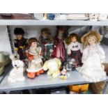 A PAIR OF BESWICK POTTERY MANTEL DOGS AND SEVEN MODERN BISQUE HEADED CHARACTER DOLLS IN COSTUME