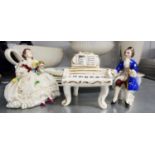 A MODERN DRESDEN CHINA GROUP OF THREE PIECES, VIZ A COURTIER SEATED TO PLAY, A PIANO AND A SEATED