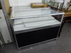 A MATCHING PAIR OF JEWELLERY COUNTER DISPLAY CABINETS, THE LOWER SECTIONS HAVING STORAGE AREA, THE