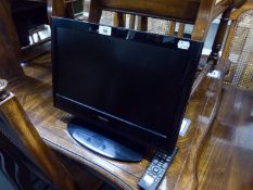 A SMALL TOSHIBA FLAT SCREEN TELEVISION