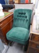 ARMLESS EASY CHAIR, THE BUTTON UPHOLSTERED BACK AND SPRUNG SEAT COVERED IN EMERALD GREEN VELVET ON