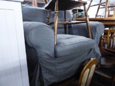 A LOUNGE ARMCHAIR WITH GREY LOOSE COVER