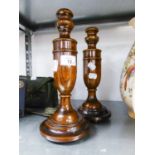 A PAIR OF TURNED OAK URN SHAPED CANDLESTICKS