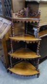 A VICTORIAN ROSEWOOD FOUR TIER GRADUATED WHAT-NOT WITH BARLEY TWIST SUPPORTS, 46" (117cm) high