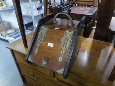 A LATE VICTORIAN OAK BRASS BOUND COAL PURDOMIUM