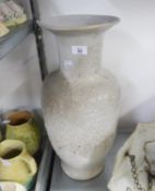 A TALL PROBABLY WEST GERMAN STONEWARE VASE WITH BUBBLED GLAZE