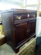 A MAHOGANY DWARF CUPBOARD WITH ONE LONG DRAWER OVER A PAIR OF FRAMED PANEL DOORS, ON  BRACKET