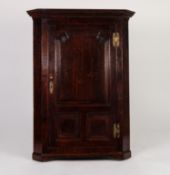 GEORGIAN OAK FLAT FRONTED CORNER CUPBOARD, the moulded cornice above a single cupboard door with