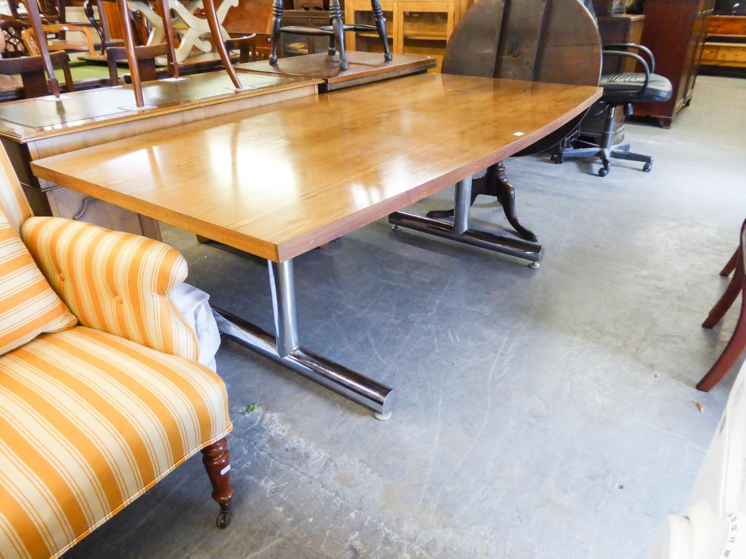 A MID CENTURY DINING TABLE WITH CHROME BASE