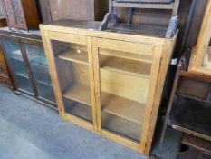 OAK DWARF BOOKCASE, ENCLOSED BY TWO GLAZED DOORS