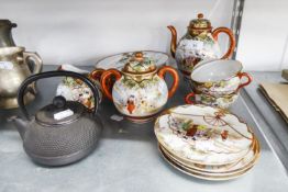 A 17 PIECE JAPANESE EGGSHELL PART TEA SERVICE AND A JAPANESE CAST IRON TEAPOT