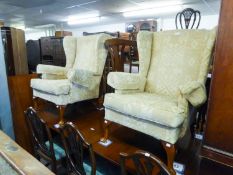 A PAIR OF FIRESIDE WING BACK ARMCHAIRS, ON CABRIOLE SUPPORTS