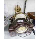 AN ANNIVERSARY CLOCK WITH GLASS DOME SHADE, A SPRING DRIVEN MANTEL CLOCK IN METAL FRAME AND A