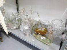 A QUANTITY OF GLASSWARES TO INCLUDE; FIVE DECANTERS WITH STOPPERS, TWO BASKET BOWLS, JUGS  AND OTHER