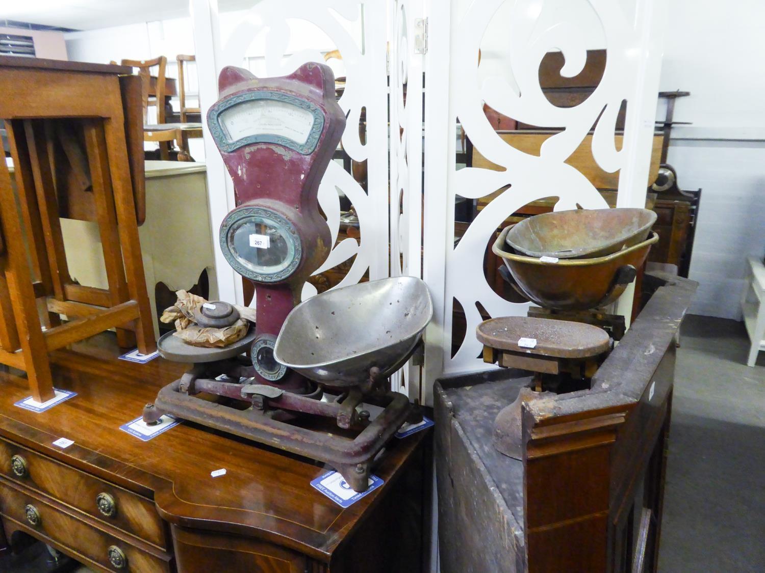 A LARGE SHOP SCALE AND A KITCHEN BALANCE SCALE WITH PANS AND WEIGHTS
