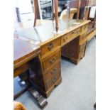 A REPRODUCTION YEWTREE VENEERED KNEEHOLE DESK
