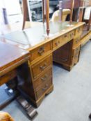 A REPRODUCTION YEWTREE VENEERED KNEEHOLE DESK