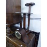 AN OAK SMOKERS COMPANION STAND AND OVAL COFFEE TABLE COMBINED; AN OAK NAPOLEON'S HAT SHAPED MANTEL