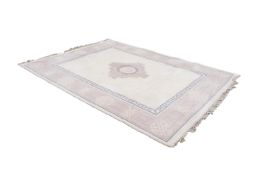 CHINESE CARPET with embossed design, plain off-white field with mauve stepped sided quatrefoil