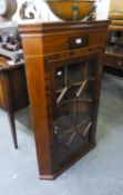 A MAHOGANY CORNER CUPBOARD WITH ASTRAGAL GLAZED DOORS