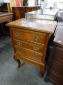 A GEORGIAN STYLE MAHOGANY SMALL CHEST OF THREE DRAWERS WITH BRASS DROP HANDLES  WITH PIERCED BACK