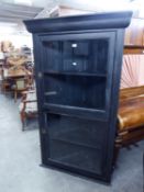 EARLY TWENTIETH CENTURY BLACK PAINTED HANGING DISPLAY CORNER CUPBOARD OF LARGE PROPORTIONS, THE