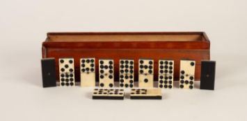 SET OF EBONY AND BONE DOMINOES, in slide top blonde wood box, split to top