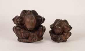 TWO 20th CENTURY INDONESIAN EBONY 'WEEPING BUDDHA' CARVINGS