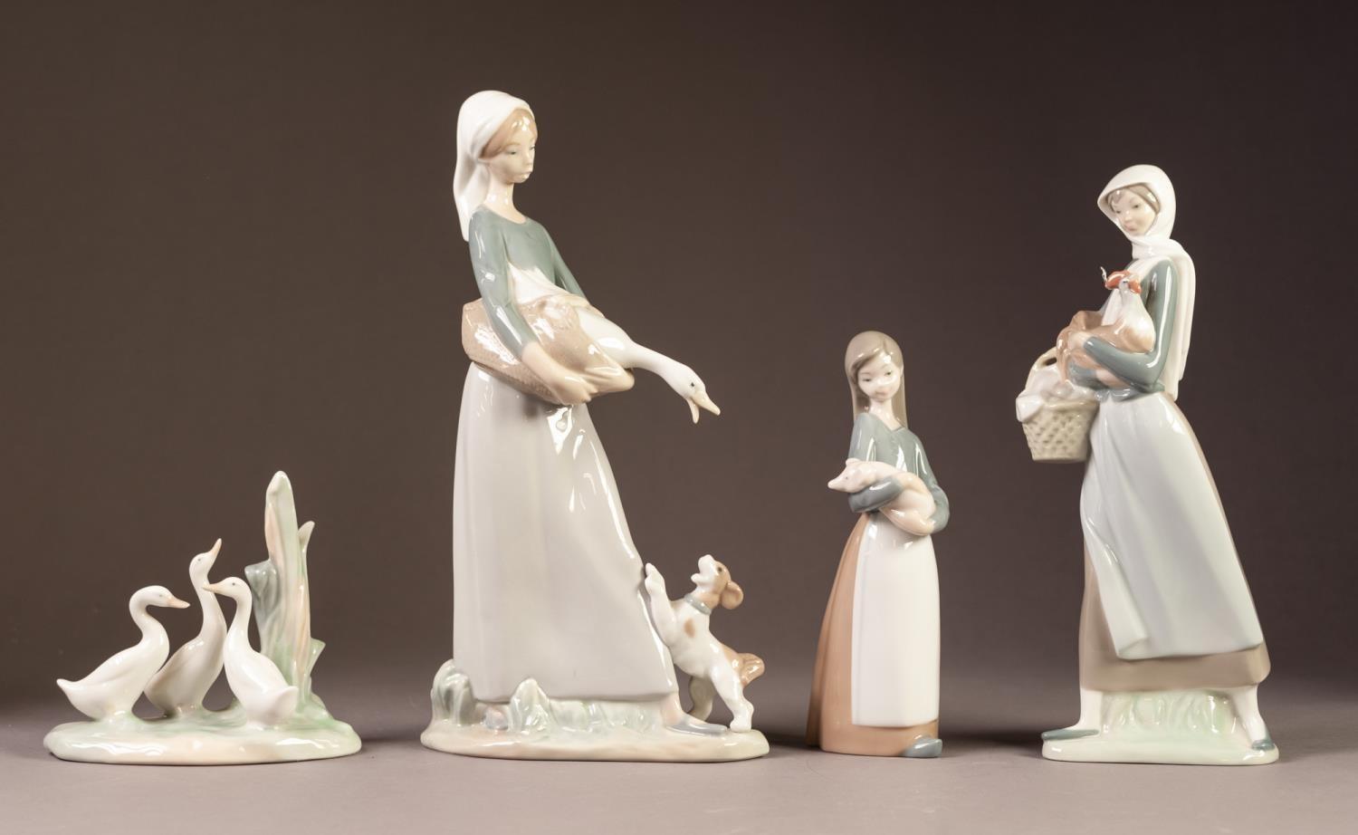 THREE LLADRO PORCELAIN FIGURES AND A NAO MODEL of three geese, the largest 11" (28cm) high (4)