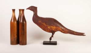 Painted metal model of a pheasant, mounted on a rounded oblong base, 15 ½? (39.3cm) high, together