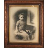 EARLY 20th CENTURY LARGE PHOTOGRAPHIC IMAGE OF A SEATED CHILD, in contemporary oak frame with gilt