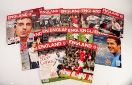 FOURTEEN ENGLAND HOME PROGRAMMES PLAYED AT OLD TRAFFORD, to include Spain, Polan, Greece, etc.