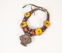 AGED TIBETAN NECKLACE, the fabric body applied with amber, coral turquoise, lapis lazuli, agate