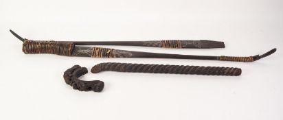*AGED INDIAN CARVED DARK HARDWOOD SCEPTRE, the crook form top carved with a tiger attacking a man'