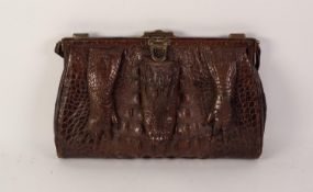 1920s CROCODILE HANDBAG, with short loop handle, brass frame with central locking catch and two