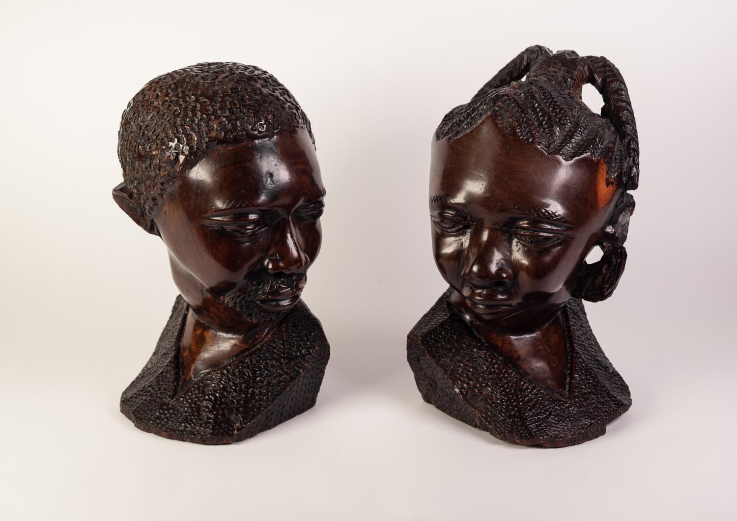 PAIR OF POST WAR AFRICAN CARVED IRONWOOD MALE AND FEMALE HEADS 13" (33) high (2)