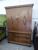 A GOOD QUALITY INTER-WAR YEARS GERMAN OAK TWO PART CABINET, THE UPPER PORTION ENCLOSED WITH TWO
