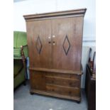 A GOOD QUALITY INTER-WAR YEARS GERMAN OAK TWO PART CABINET, THE UPPER PORTION ENCLOSED WITH TWO