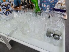 A GOOD SELECTION OF CUT AND MOULDED GLASSWARES TO INCLUDE; DECANTERS, STEM WINE GLASSES, TUMBLERS