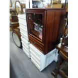 THREE WHITE FINISH FOUR DRAWER BESIDE CHESTS AND A HI-FI CABINET WITH A SMALL QUANTITY OF CD's