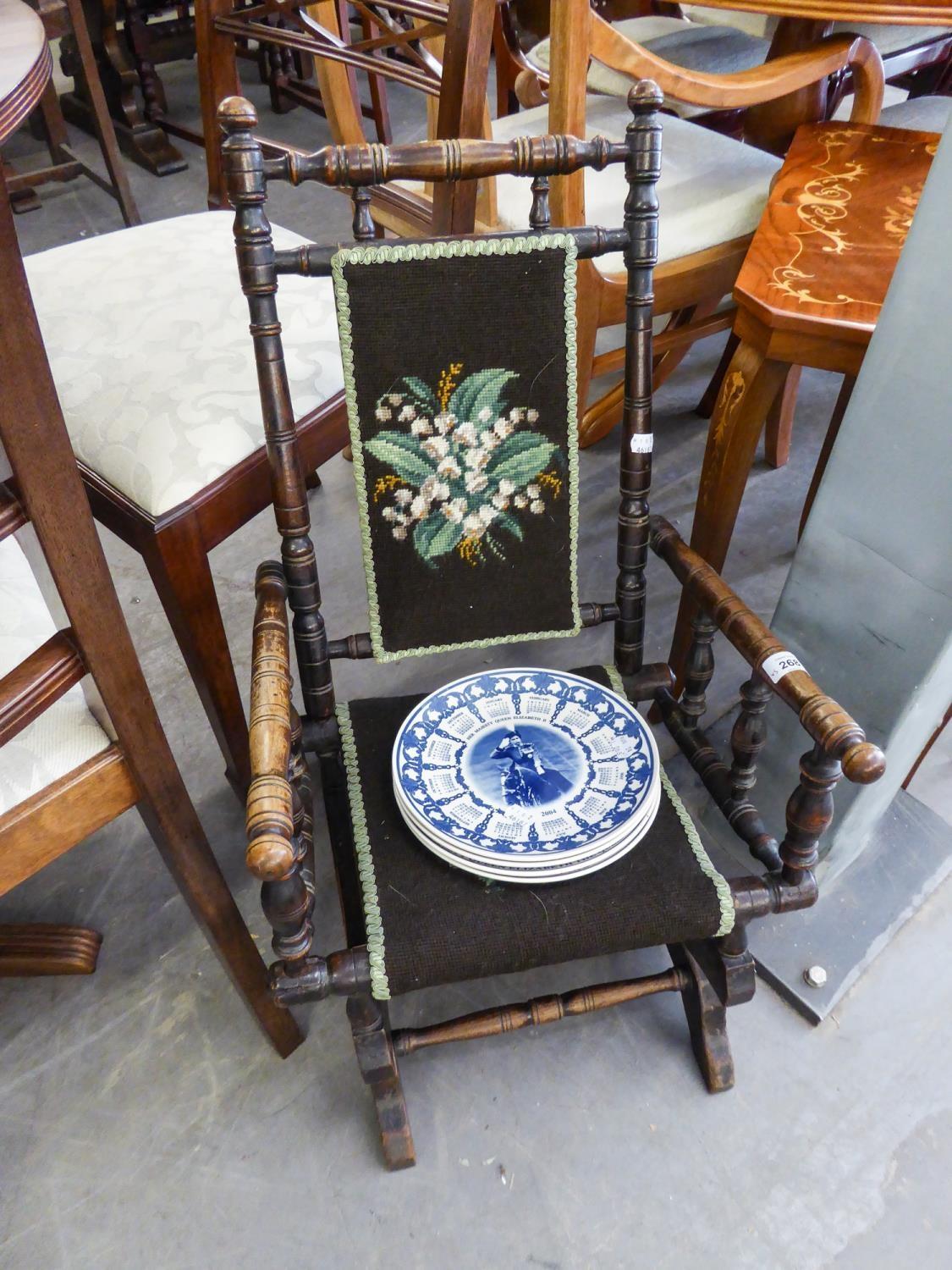 AN EARLY TWENTIETH CENTURY STAINED BEECHWOOD CHILDS ROCKING CHAIR, ALSO FOUR WEDGWOOD POTTERY RACK